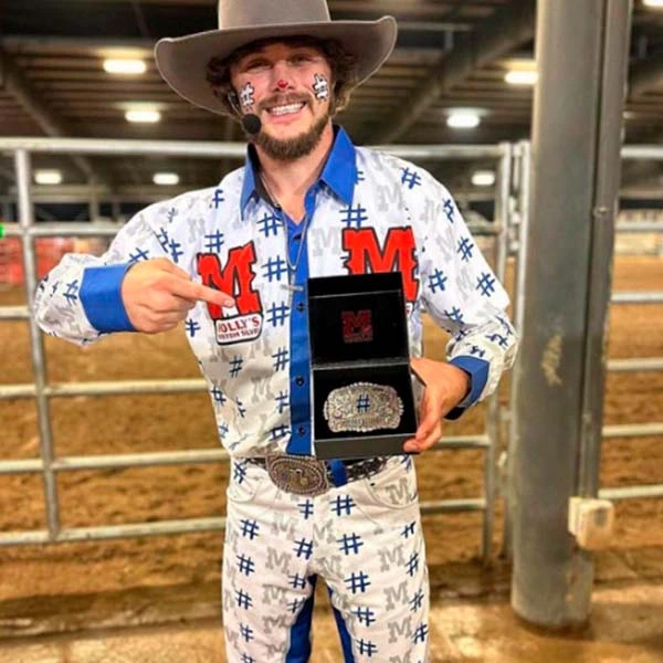 Happy Customers Gallery Cowboy holding custom belt buckle.